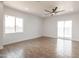 Bright living room featuring wood-look tile flooring, recessed lighting, and a modern ceiling fan at 8226 W Swansea Dr, Arizona City, AZ 85123