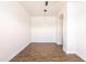 Open concept living area with stylish flooring, modern lighting, and smooth white walls creating a blank canvas at 8226 W Swansea Dr, Arizona City, AZ 85123