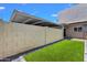 Low-maintenance backyard featuring artificial grass and privacy walls at 8329 E Keim Dr, Scottsdale, AZ 85250