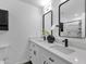 Stylish bathroom featuring dual sinks and sleek black hardware at 8329 E Keim Dr, Scottsdale, AZ 85250
