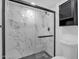 Walk-in shower featuring marble-look tile and modern fixtures at 8329 E Keim Dr, Scottsdale, AZ 85250