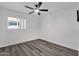 An airy bedroom featuring stylish ceiling fan and window at 8329 E Keim Dr, Scottsdale, AZ 85250