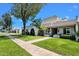 Desirable home exterior with lush landscaping, a welcoming entrance, and a tree-lined street at 8329 E Keim Dr, Scottsdale, AZ 85250