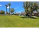 Beautiful home with a lush green lawn and mature trees in a desirable neighborhood at 8329 E Keim Dr, Scottsdale, AZ 85250