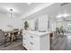 Bright eat-in kitchen featuring a central island and modern lighting fixtures at 8329 E Keim Dr, Scottsdale, AZ 85250