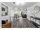 Open-concept living room features wood floors, neutral walls, and lots of natural light at 8329 E Keim Dr, Scottsdale, AZ 85250