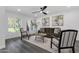 Stylish living room features a ceiling fan, art, and comfortable seating arrangement at 8329 E Keim Dr, Scottsdale, AZ 85250
