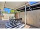 Charming patio features a table with chairs, covered area, and privacy wall at 8329 E Keim Dr, Scottsdale, AZ 85250