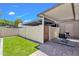 Inviting patio with artificial grass and covered seating area, perfect for outdoor relaxation at 8329 E Keim Dr, Scottsdale, AZ 85250