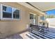 Serene patio with comfortable seating and sliding door access to the home at 8329 E Keim Dr, Scottsdale, AZ 85250