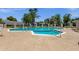 Enjoy this sparkling community pool with lounge chairs and umbrellas on a sunny day at 8329 E Keim Dr, Scottsdale, AZ 85250