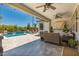 This backyard is great for entertaining with an outdoor kitchen, pool and spa at 20891 E Cattle Dr, Queen Creek, AZ 85142