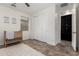 Neutral-toned Bedroom featuring tile floors, natural wood crib and closet with sliding doors at 20891 E Cattle Dr, Queen Creek, AZ 85142