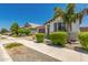 Well maintained single-story home with desert landscaping and a paver driveway at 20891 E Cattle Dr, Queen Creek, AZ 85142