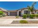 Beautiful single-story home with desert landscaping, a tile roof, and a paver driveway at 20891 E Cattle Dr, Queen Creek, AZ 85142