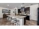 Stunning kitchen features a large island, dark cabinets, and modern appliances at 20891 E Cattle Dr, Queen Creek, AZ 85142