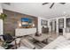 Cozy living room with natural light, and a modern entertainment center at 20891 E Cattle Dr, Queen Creek, AZ 85142