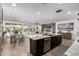 Open-concept living area seamlessly blends the kitchen, dining, and living spaces at 20891 E Cattle Dr, Queen Creek, AZ 85142