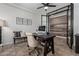 Well-appointed office with glass doors, modern desk, and natural light at 20891 E Cattle Dr, Queen Creek, AZ 85142