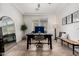 Bright and airy office featuring a modern desk, bench, and neutral decor at 20891 E Cattle Dr, Queen Creek, AZ 85142