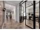 Modern office featuring glass doors, stylish desk, and bright, neutral tones at 20891 E Cattle Dr, Queen Creek, AZ 85142