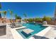 Beautiful pool with tanning ledge surrounded by lush greenery, offering a serene and private outdoor retreat at 20891 E Cattle Dr, Queen Creek, AZ 85142