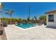 Inviting backyard pool with beautiful tile accents and cool deck, surrounded by lush landscaping for ultimate relaxation at 20891 E Cattle Dr, Queen Creek, AZ 85142