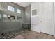 Modern walk-in shower with tile accents and glass door, enhancing the spa-like experience at 20891 E Cattle Dr, Queen Creek, AZ 85142
