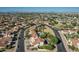 Expansive aerial shot of the neighborhood featuring well-kept homes, streets, and lush greenery at 401 E Barbara Dr, Tempe, AZ 85288