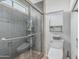 Bathroom featuring a glass enclosed shower, tiled walls, and modern fixtures at 401 E Barbara Dr, Tempe, AZ 85288