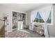 Bright Bedroom showcases a closet with built-in storage, window with curtains and neutral colored area rug at 401 E Barbara Dr, Tempe, AZ 85288