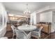 Elegant dining area features a chandelier, stylish chairs, and hardwood floors at 401 E Barbara Dr, Tempe, AZ 85288