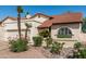 Charming single-story home features a desert landscape, red tile roof, and white stucco exterior at 401 E Barbara Dr, Tempe, AZ 85288