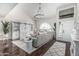 Bright and airy living room with soaring ceilings, a large arched window, and hardwood floors at 401 E Barbara Dr, Tempe, AZ 85288