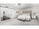 Bright main bedroom boasts a cozy bed, elegant decor, and a sliding barn door at 401 E Barbara Dr, Tempe, AZ 85288