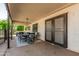 Covered patio area includes an outdoor dining set, creating a perfect space for entertaining and relaxation at 401 E Barbara Dr, Tempe, AZ 85288