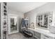 Walk-in closet featuring ample storage, vanity with illuminated mirror, and plush carpeting at 401 E Barbara Dr, Tempe, AZ 85288