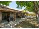 Spacious backyard features a covered patio area with ample seating and lush landscaping at 4525 N 66Th St # 112, Scottsdale, AZ 85251