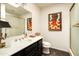 Bathroom featuring a vanity with dark wood cabinets and white sink at 4525 N 66Th St # 112, Scottsdale, AZ 85251