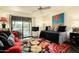 Cozy bedroom with a colorful rug, comfortable seating, and a sliding glass door at 4525 N 66Th St # 112, Scottsdale, AZ 85251