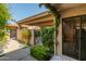 Charming front entrance featuring well-maintained landscaping and a welcoming gate at 4525 N 66Th St # 112, Scottsdale, AZ 85251