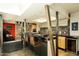 Modern kitchen features a unique island design, breakfast bar seating, and seamless transition to the dining area at 4525 N 66Th St # 112, Scottsdale, AZ 85251