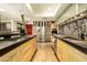 The kitchen showcases a functional layout with stainless steel appliances, custom cabinetry, and stylish backsplash at 4525 N 66Th St # 112, Scottsdale, AZ 85251