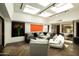 Spacious living room featuring contemporary furnishings, skylights, and artistic decor, perfect for relaxation and entertainment at 4525 N 66Th St # 112, Scottsdale, AZ 85251