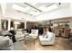 Open-concept living room with skylights, modern seating, and seamlessly connected dining and kitchen areas for easy living at 4525 N 66Th St # 112, Scottsdale, AZ 85251