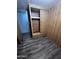 A bedroom with wood style walls, a closet and drawers at 530 S Alma School Rd # 50, Mesa, AZ 85210