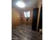 A bedroom with wood style walls, a window and a mirror at 530 S Alma School Rd # 50, Mesa, AZ 85210