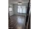 A kitchen with wood-style flooring, curtains and a fan at 530 S Alma School Rd # 50, Mesa, AZ 85210