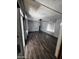 Bright living room with sliding glass door and wood-look floors that creates a welcoming atmosphere at 530 S Alma School Rd # 50, Mesa, AZ 85210