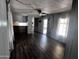 Cozy living room featuring stylish wood-look floors and natural light from the windows at 530 S Alma School Rd # 50, Mesa, AZ 85210